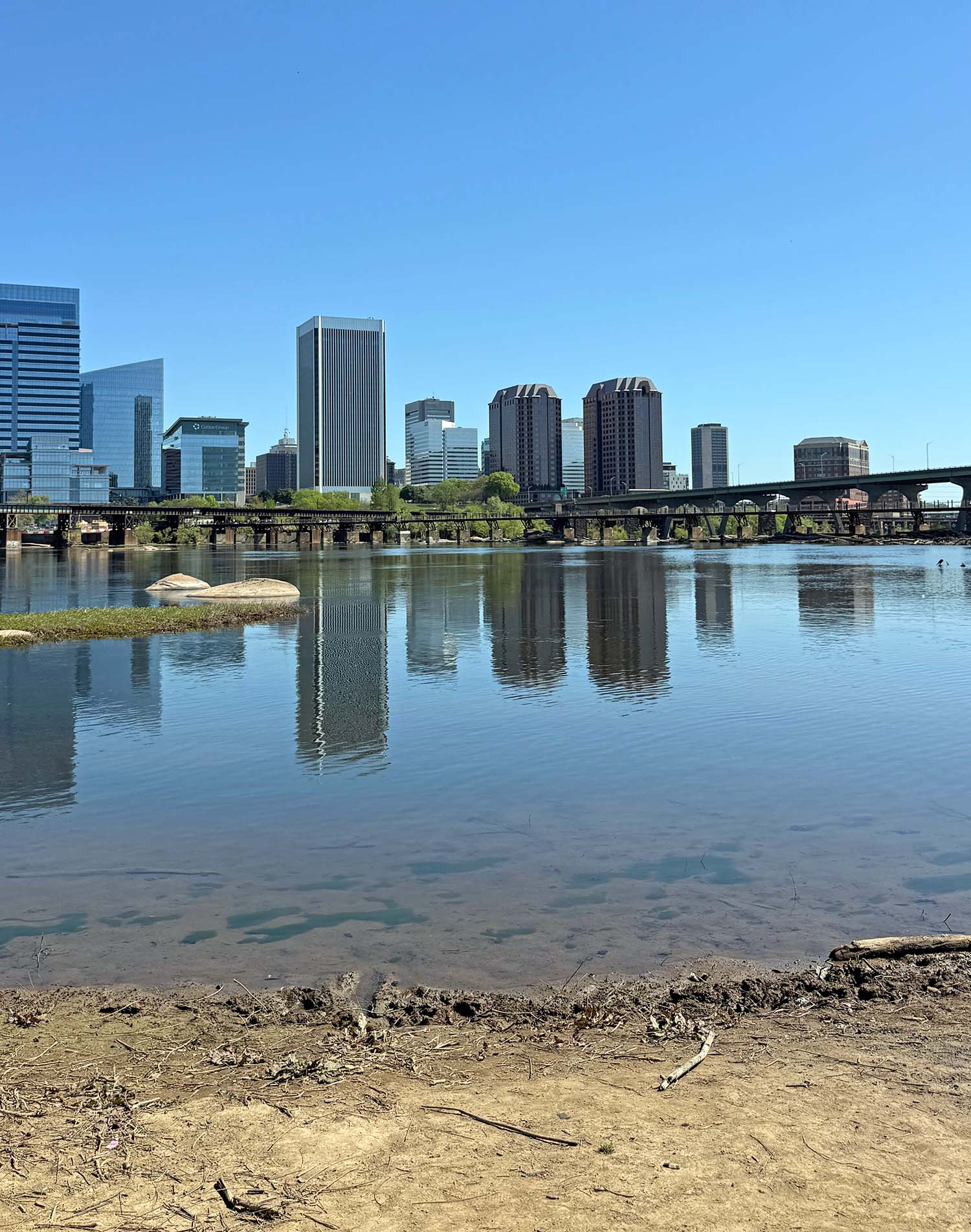 view of downtown richmond from north point beach at belle isle